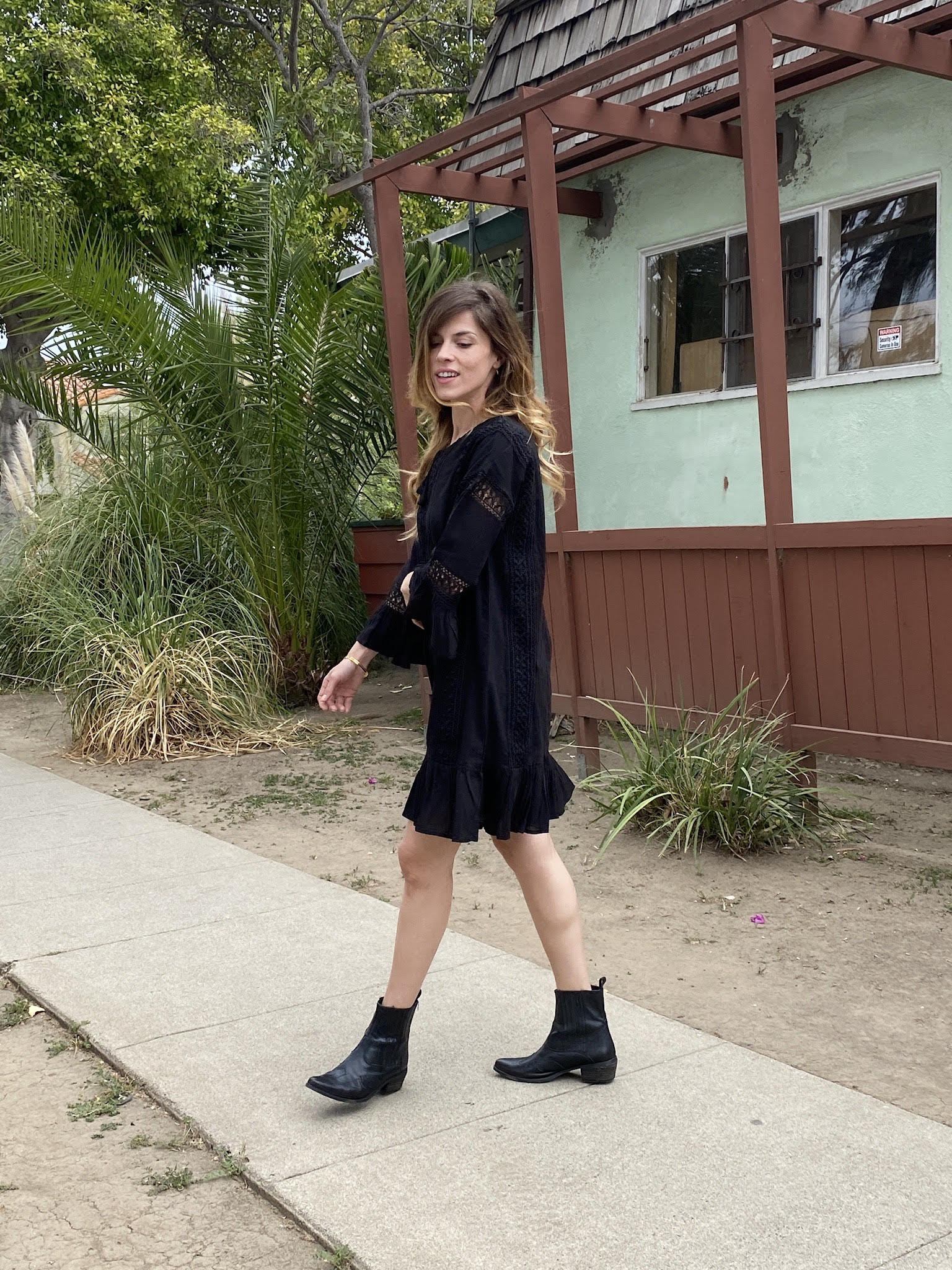 Elegant black PARADISO MINI DRESS featuring romantic lacework, ruffles at cuffs and hem, made from breathable cotton-gauze.