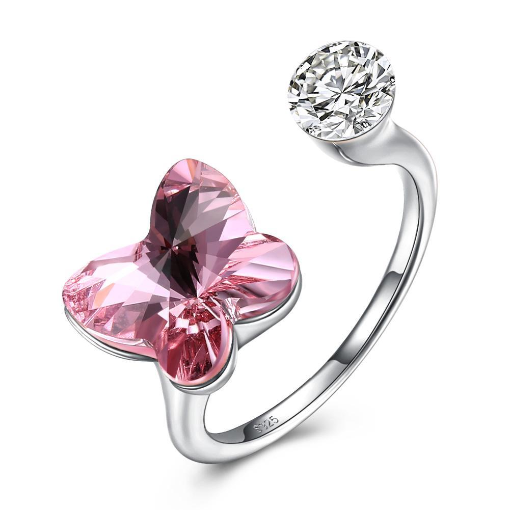 A delicate pink sapphire butterfly shaped adjustable ring made of solid sterling silver, showcasing its intricate design and genuine gemstone.