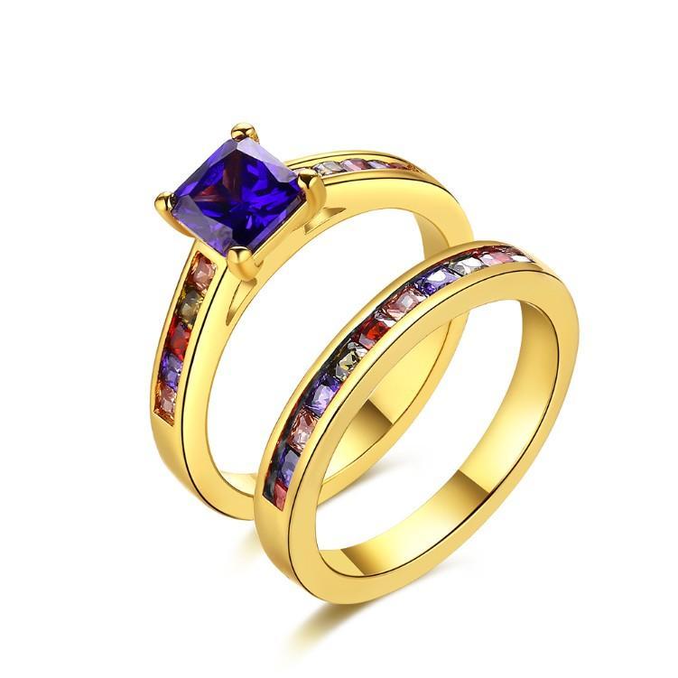 A beautiful Rainbow Crystals Duo Band Gold Ring featuring vibrant rainbow crystals set in 14K gold plated brass, showcasing a modern duo band design.