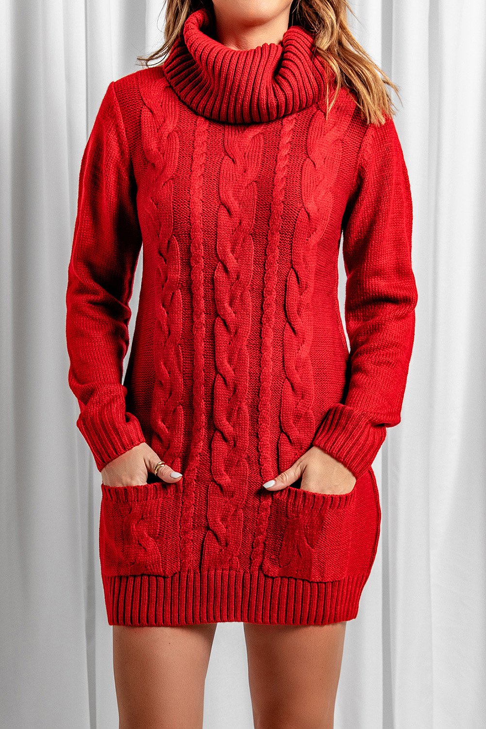 A stylish red cowl neck sweater dress with full sleeves and pockets, perfect for winter wear.