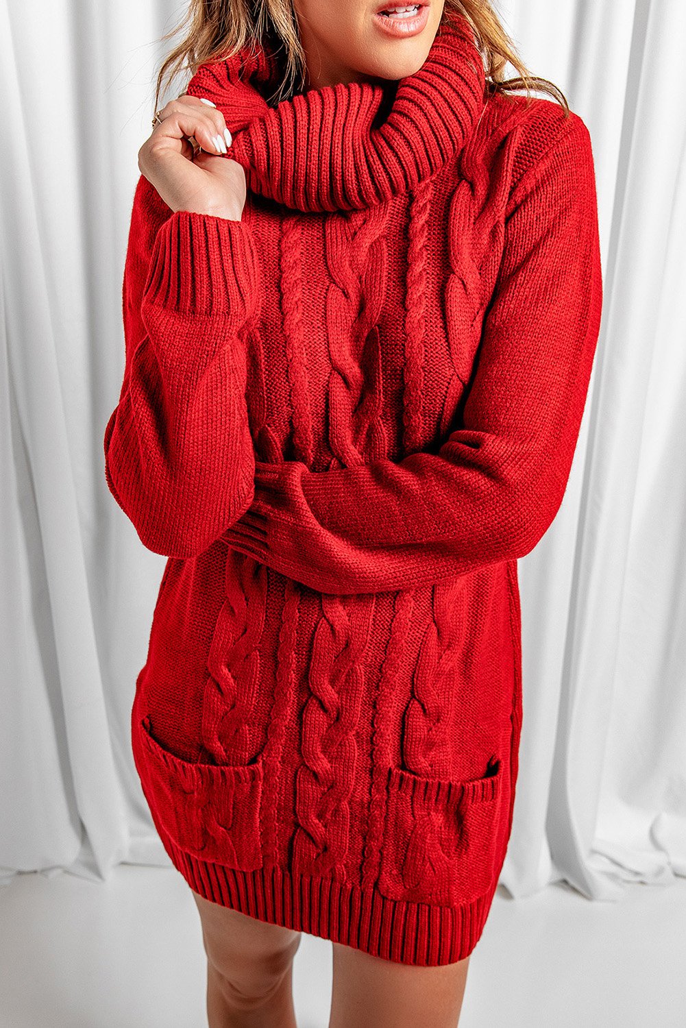 A stylish red cowl neck sweater dress with full sleeves and pockets, perfect for winter wear.