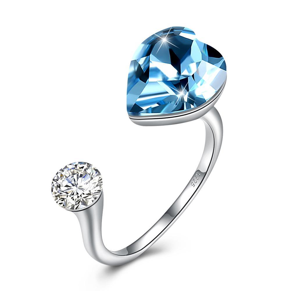 Sapphire Heart Shaped Adjustable Ring made of solid sterling silver with a genuine sapphire gemstone, showcasing its elegant design.