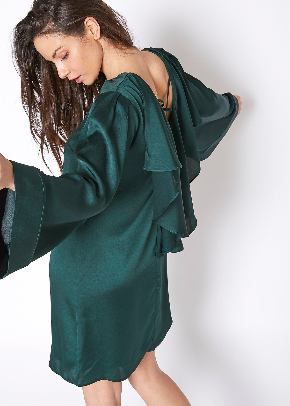 A stylish women's satin cross back tunic dress featuring batwing sleeves and a shiny finish, perfect for various occasions.