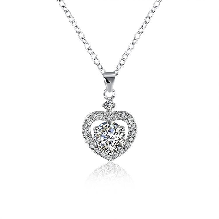 Sterling Silver necklace featuring a heart-shaped pendant adorned with sparkling Swarovski crystals in a cluster pavé design.