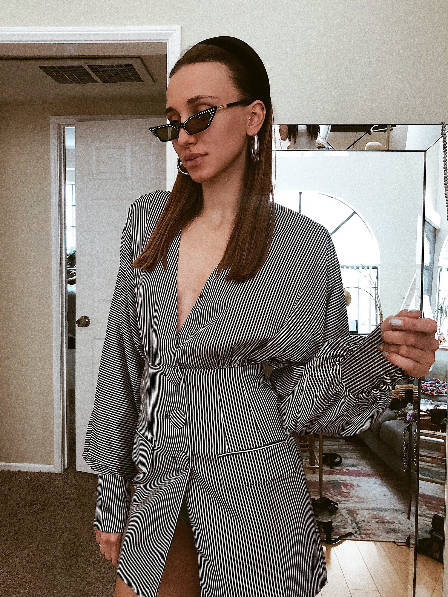 A stylish Stripe to Wine Tasting Blazer Dress featuring a plunging neckline, oversized buttons, and blouson sleeves, perfect for elegant occasions.