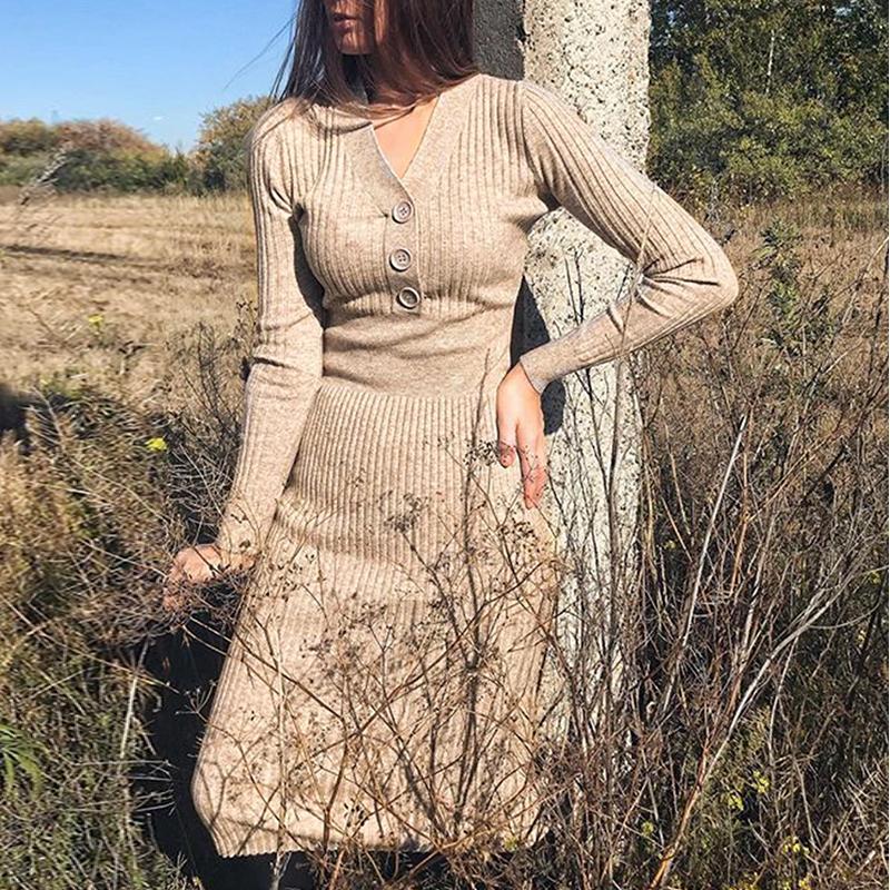 A stylish long sleeve V-neck button dress in solid apricot color, featuring an A-line silhouette and knee-length design, perfect for winter wear.