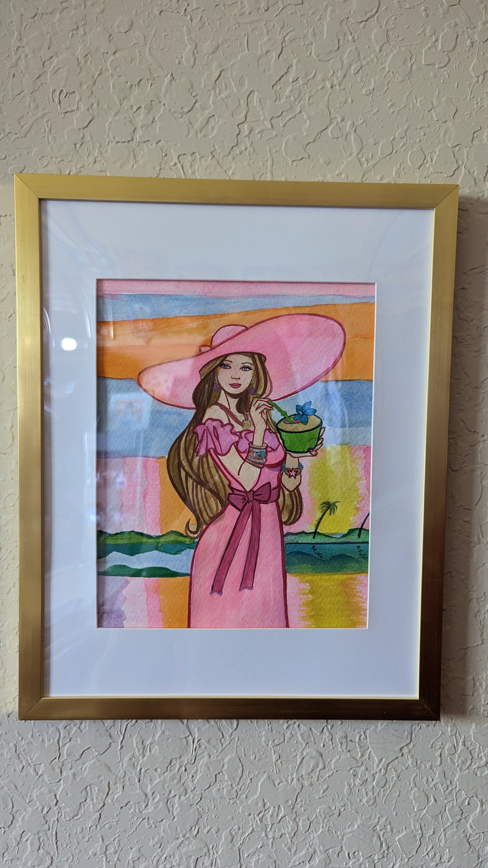 Original watercolor painting by Dominique featuring a light pink sunset over a Florida landscape, framed with plexiglass.