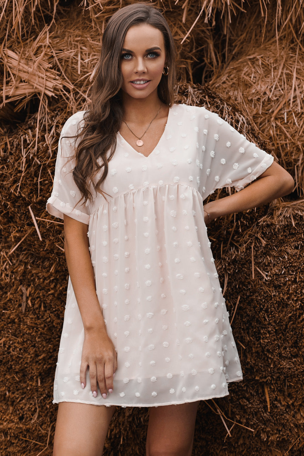 Woman wearing white polka-dot dress.