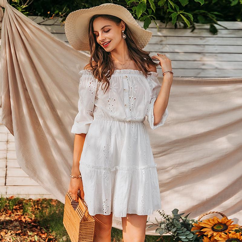 A stylish women sexy white off-shoulder dress with ruffles, made of cotton, perfect for summer occasions.