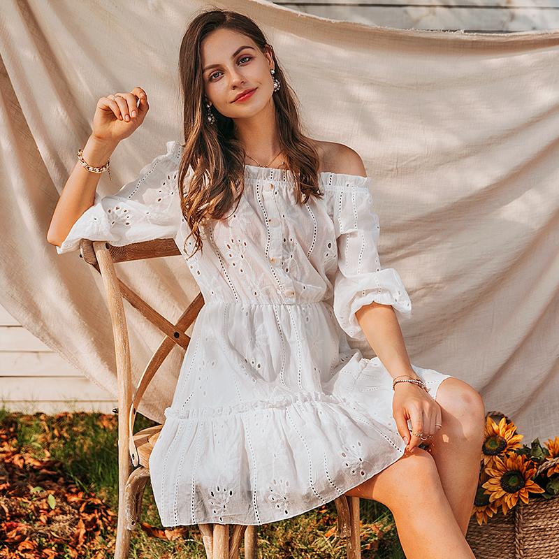 A stylish women sexy white off-shoulder dress with ruffles, made of cotton, perfect for summer occasions.