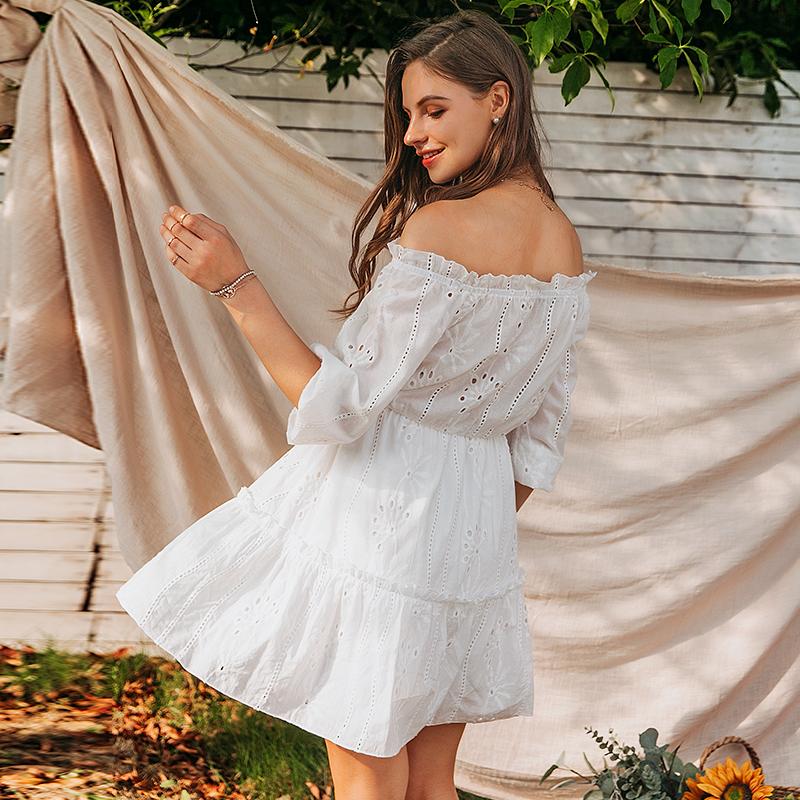 A stylish women sexy white off-shoulder dress with ruffles, made of cotton, perfect for summer occasions.