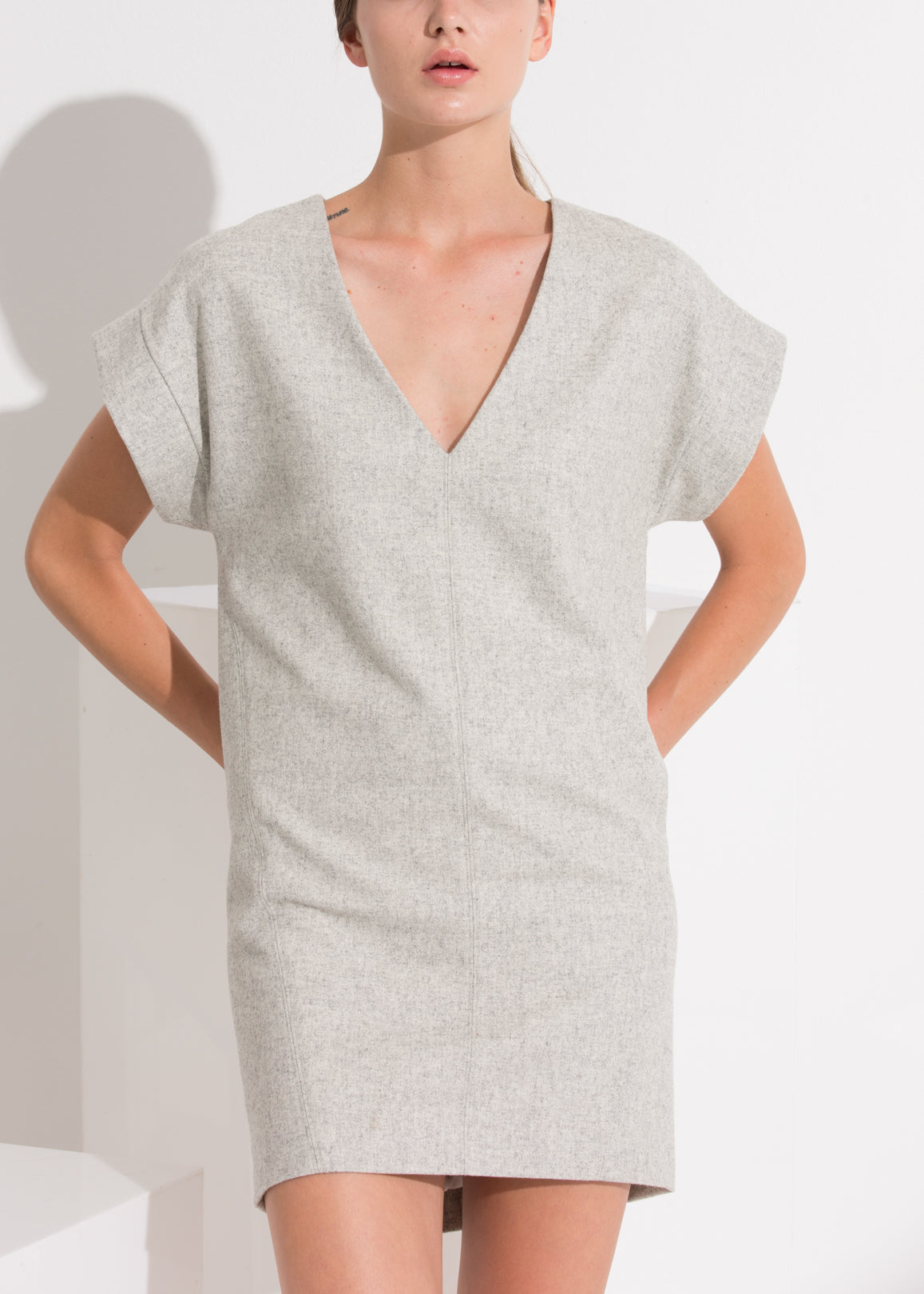 Women's Casual Heather Grey V-Neck Dress displayed on a model, showcasing its stylish design and flattering fit.