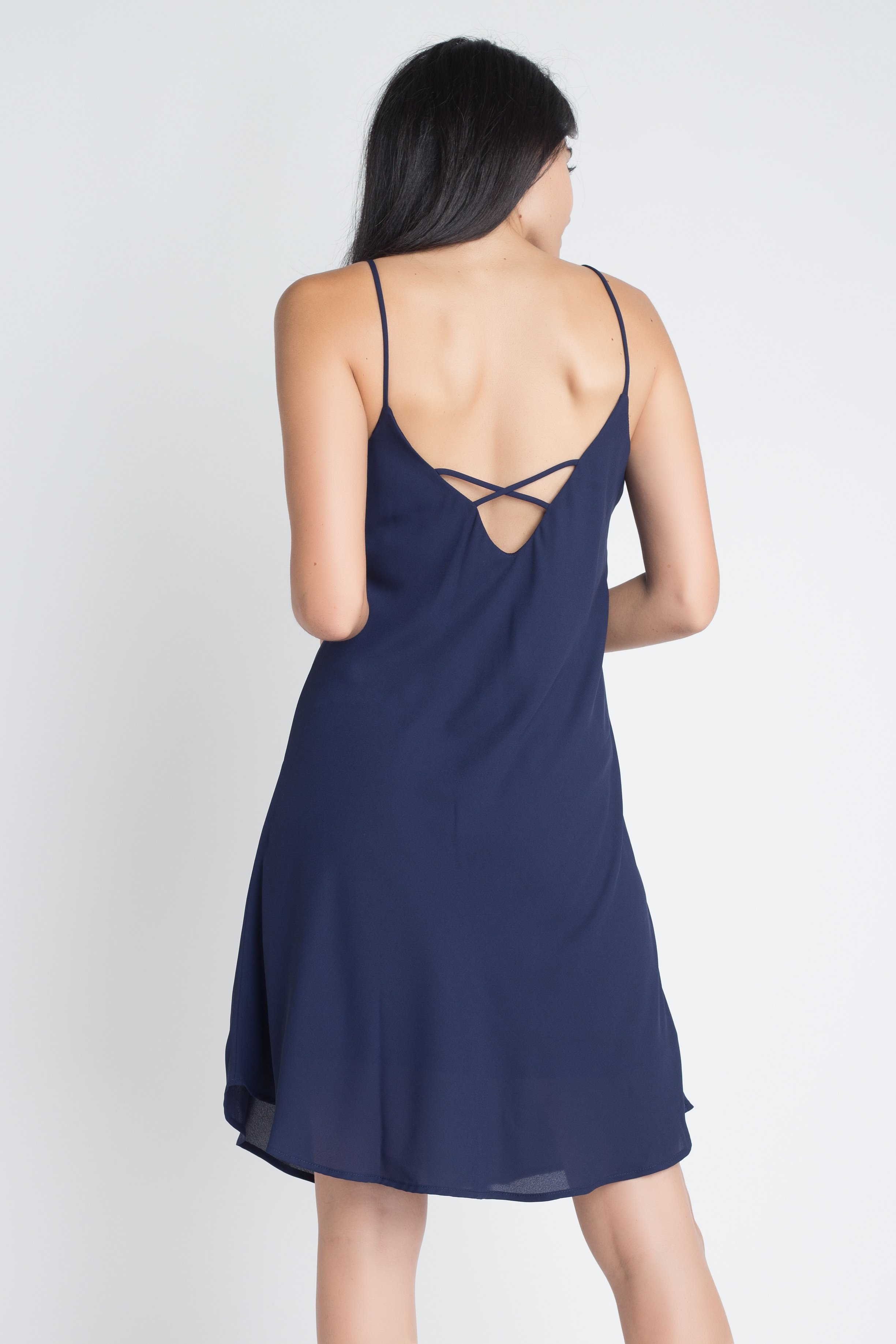 A stylish Women's Casual Sleeveless Flowy Dress featuring a criss-cross back detail, perfect for summer outings.