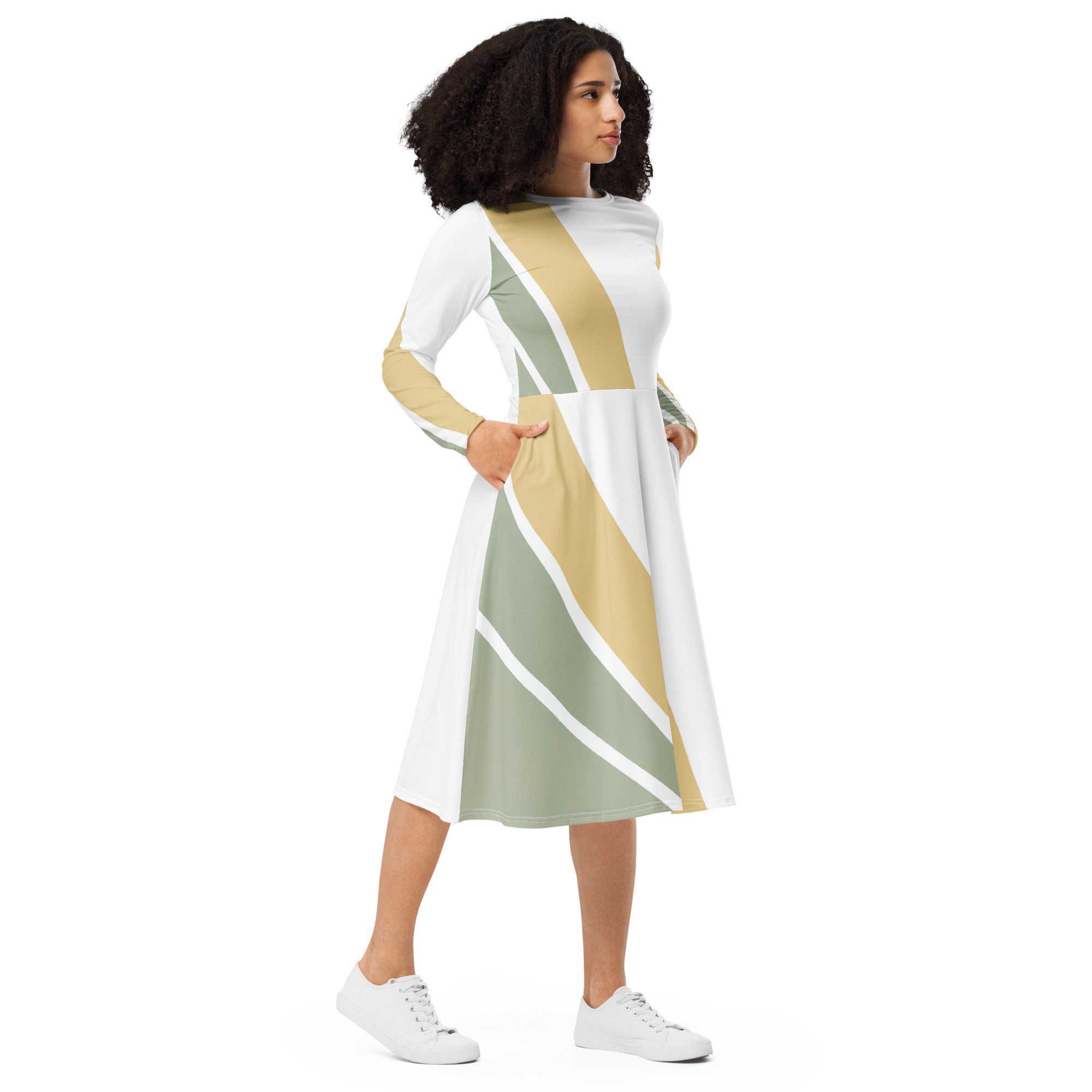 Womens Long Sleeve Midi Dress featuring a green abstract geometric pattern, showcasing its fitted waist, flared bottom, and side pockets.