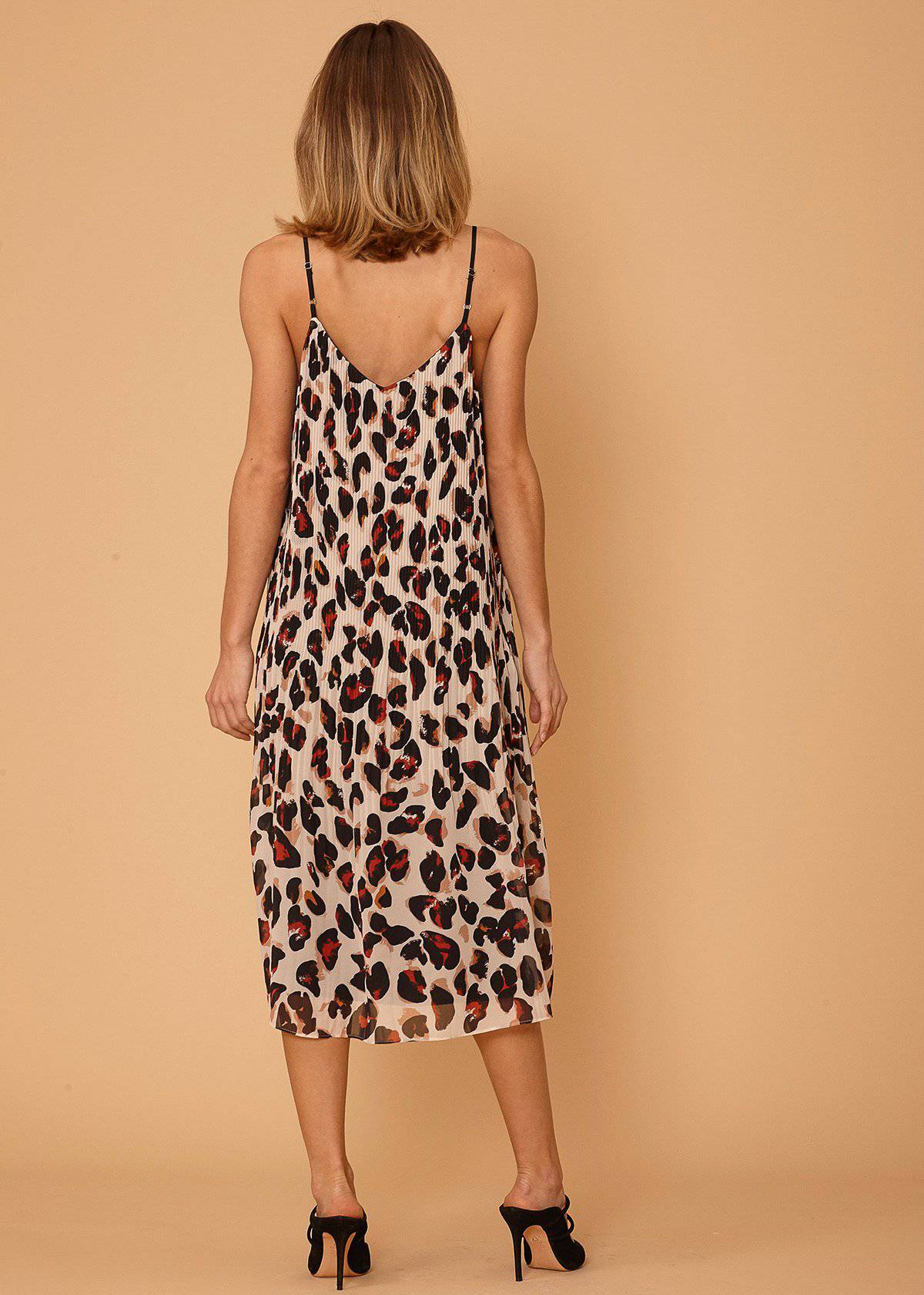 Women's pleated cami dress featuring a stylish leopard print design with adjustable straps, made from silky pebble chiffon.