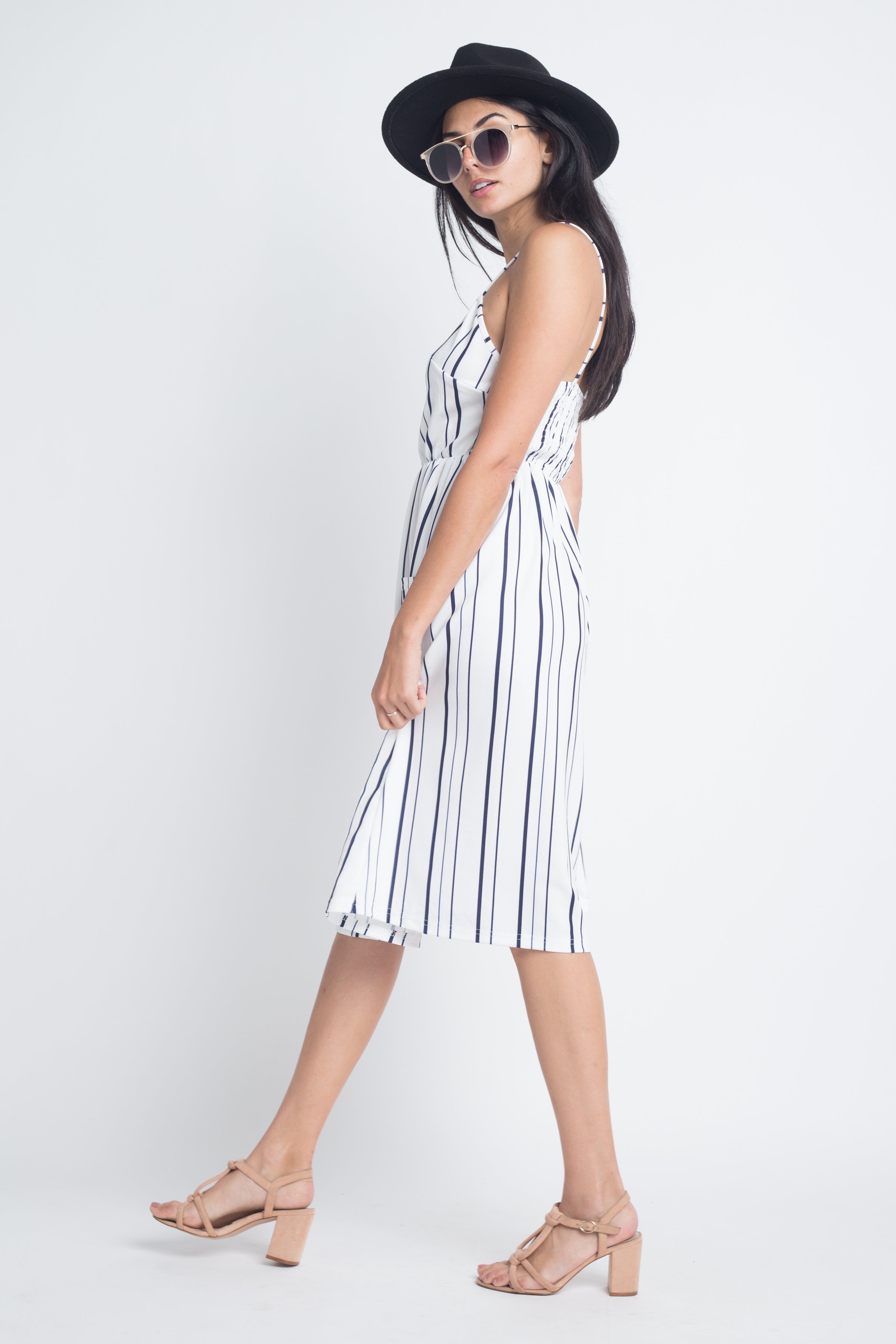 A stylish Women's Striped Button Midi Sleeveless Dress featuring vertical stripes and a button-down front, perfect for summer outings.