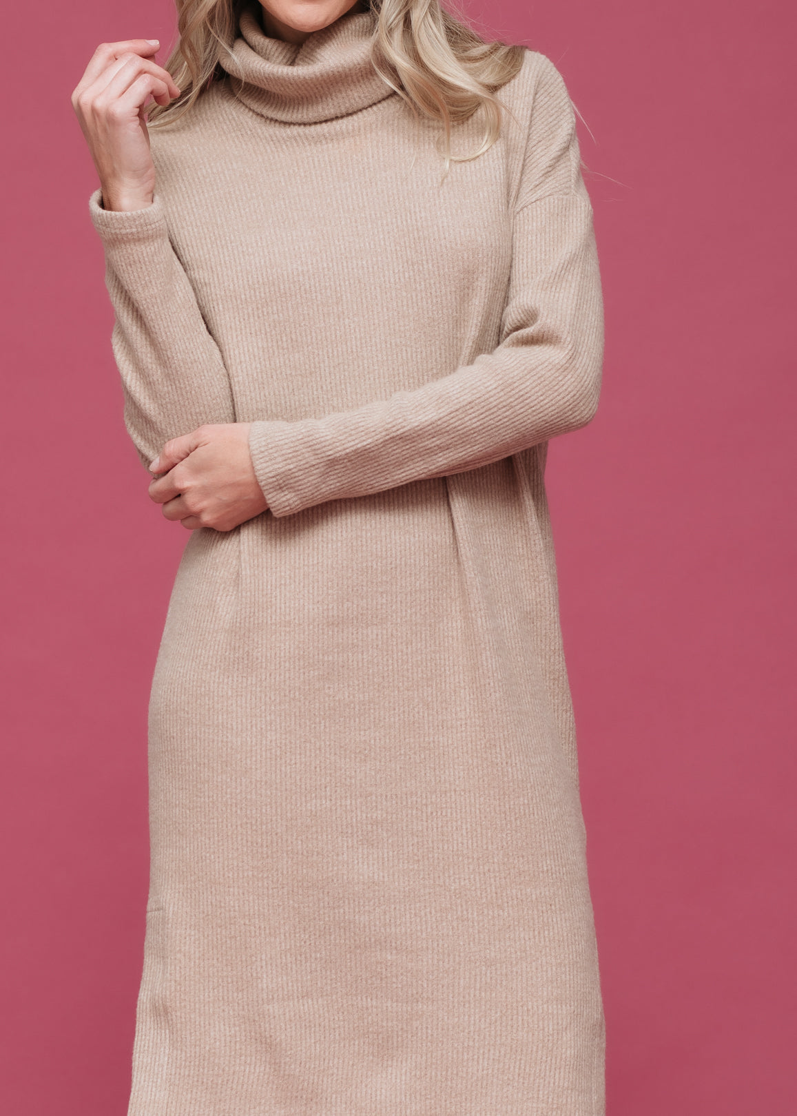 A stylish Women's Turtle Neck Midi Sweater Dress featuring long sleeves, a knee-length cut, and a side split, made from a soft fabric blend.