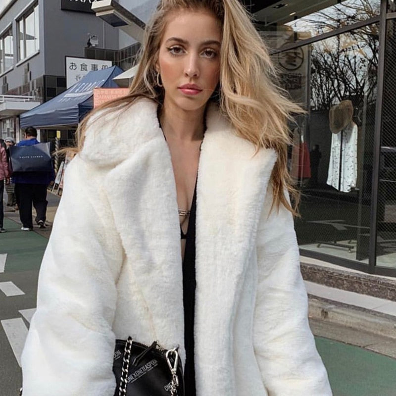 2022 New Female Winter Plush Thick Warm Loose Women Faux Rabbit Fur coat in a stylish design with a turn-down collar and covered button closure.