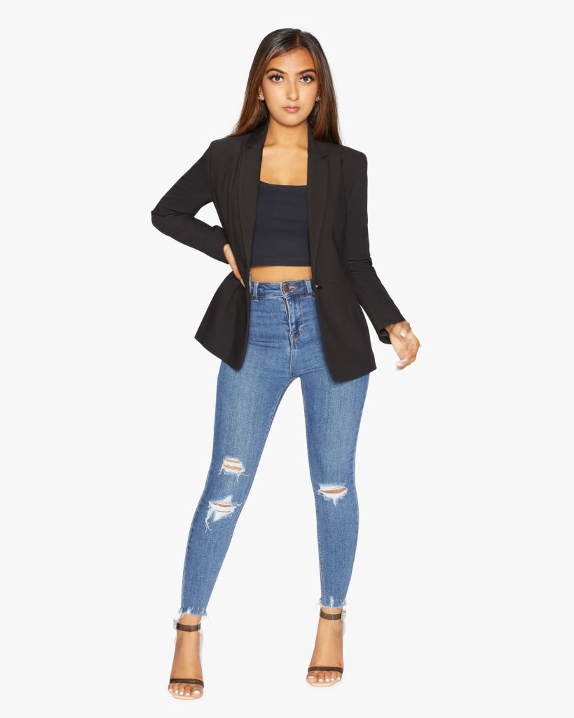 A stylish black casual blazer displayed on a mannequin, showcasing its relaxed fit and versatile design for various occasions.