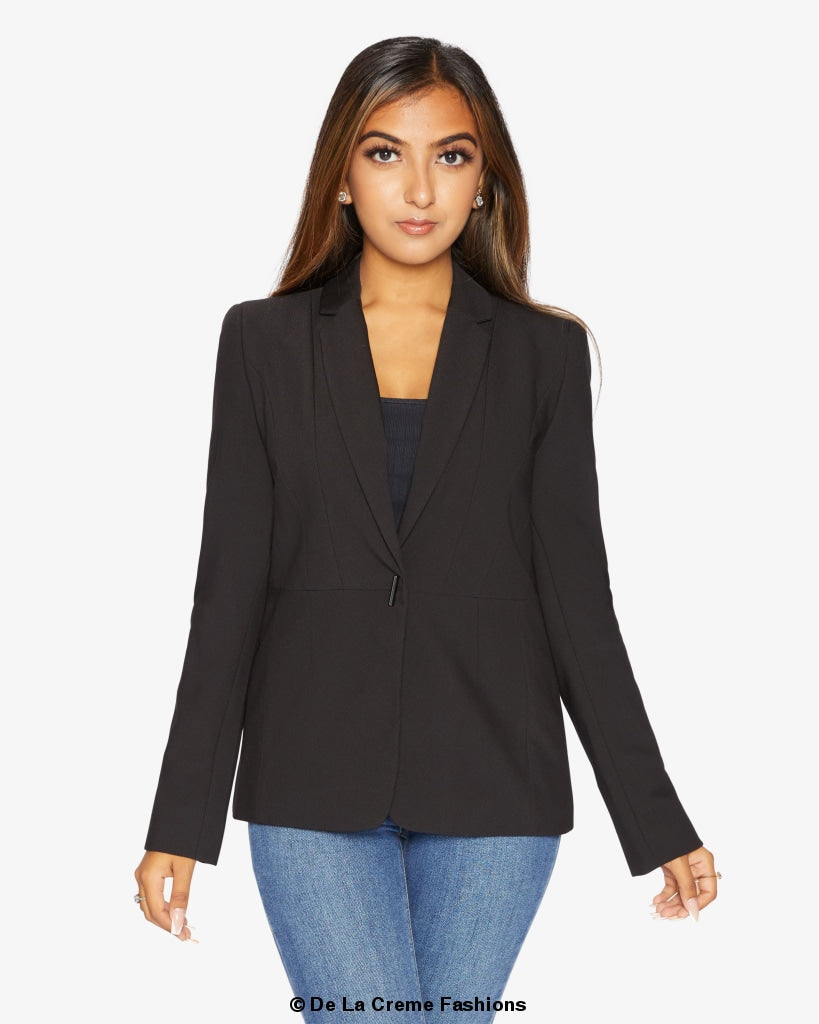 A stylish black casual blazer displayed on a mannequin, showcasing its relaxed fit and versatile design for various occasions.