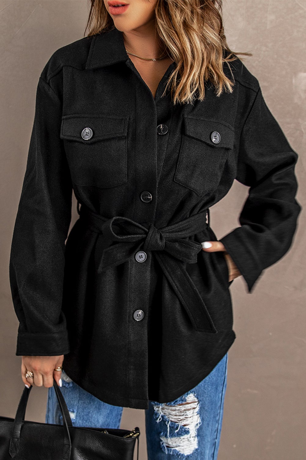 A stylish Black Lapel Button-Down Coat featuring full sleeves, chic chest pockets, and a turn-down collar, perfect for winter wear.