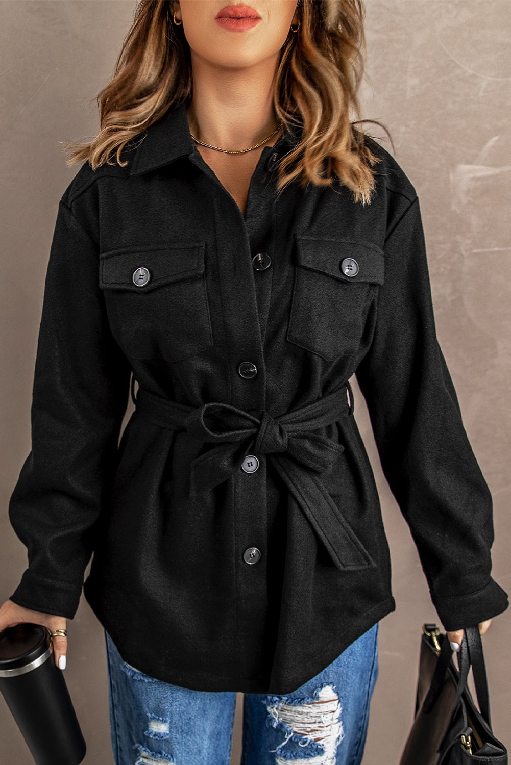 A stylish Black Lapel Button-Down Coat featuring full sleeves, chic chest pockets, and a turn-down collar, perfect for winter wear.