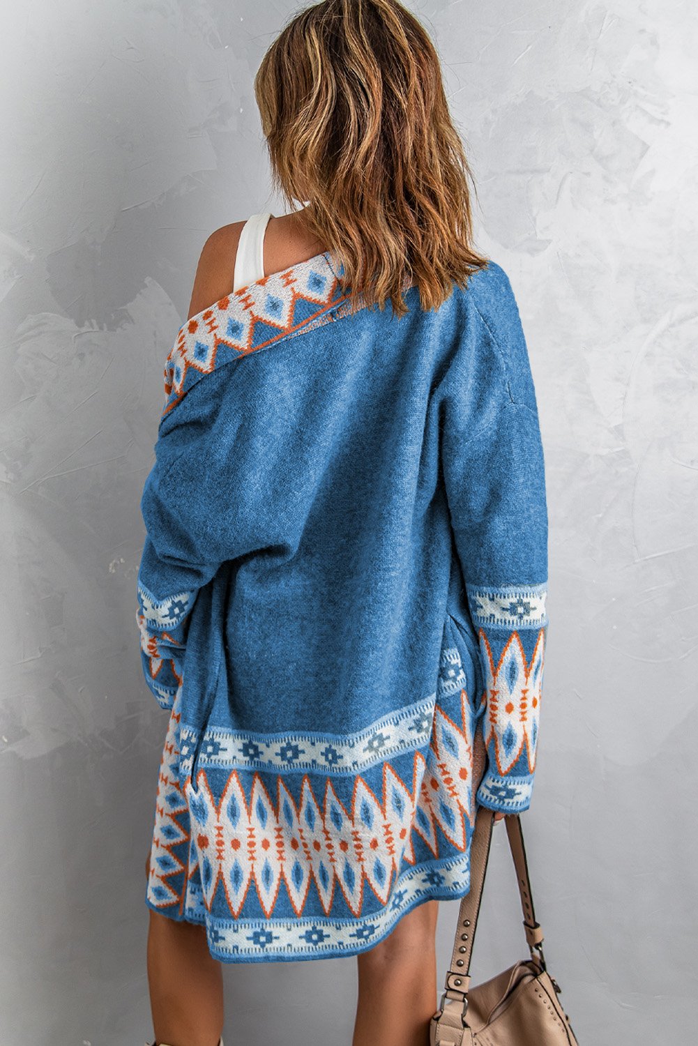 A stylish blue cardigan featuring a unique Aztec print design, open front, and full sleeves, perfect for casual wear.