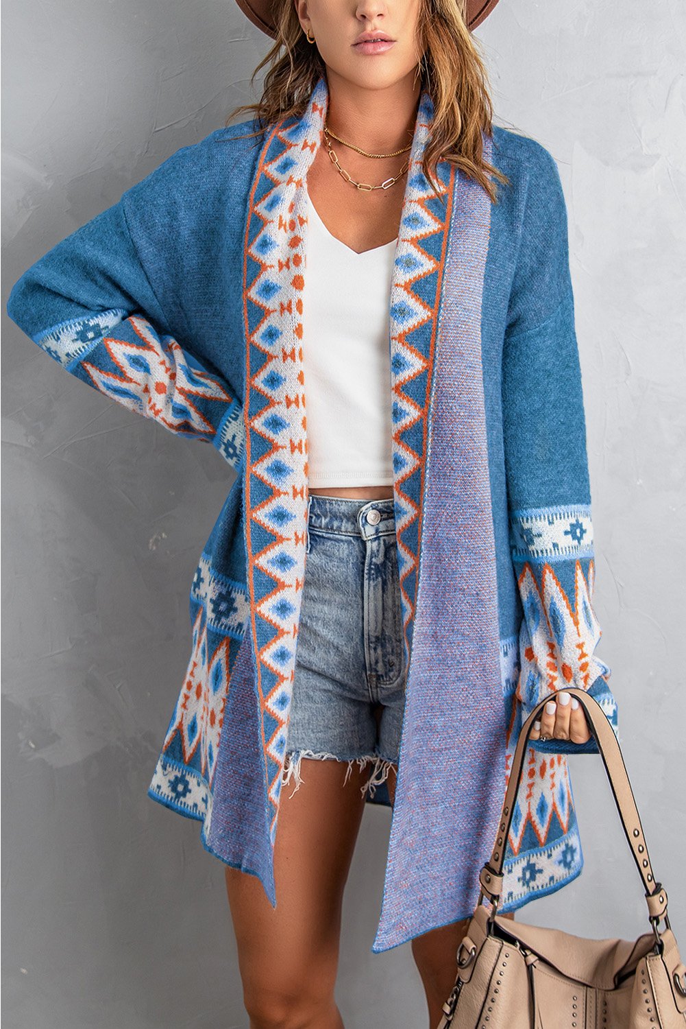 A stylish blue cardigan featuring a unique Aztec print design, open front, and full sleeves, perfect for casual wear.