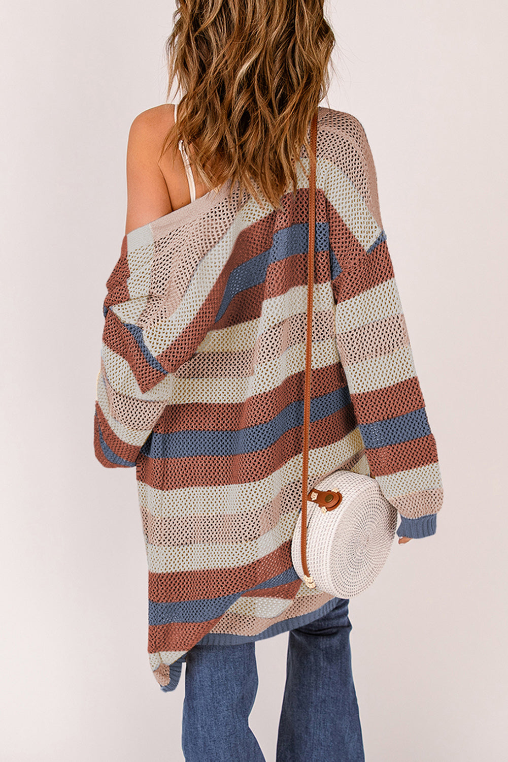 A stylish blue striped knit cardigan with a color block design, perfect for fall layering.