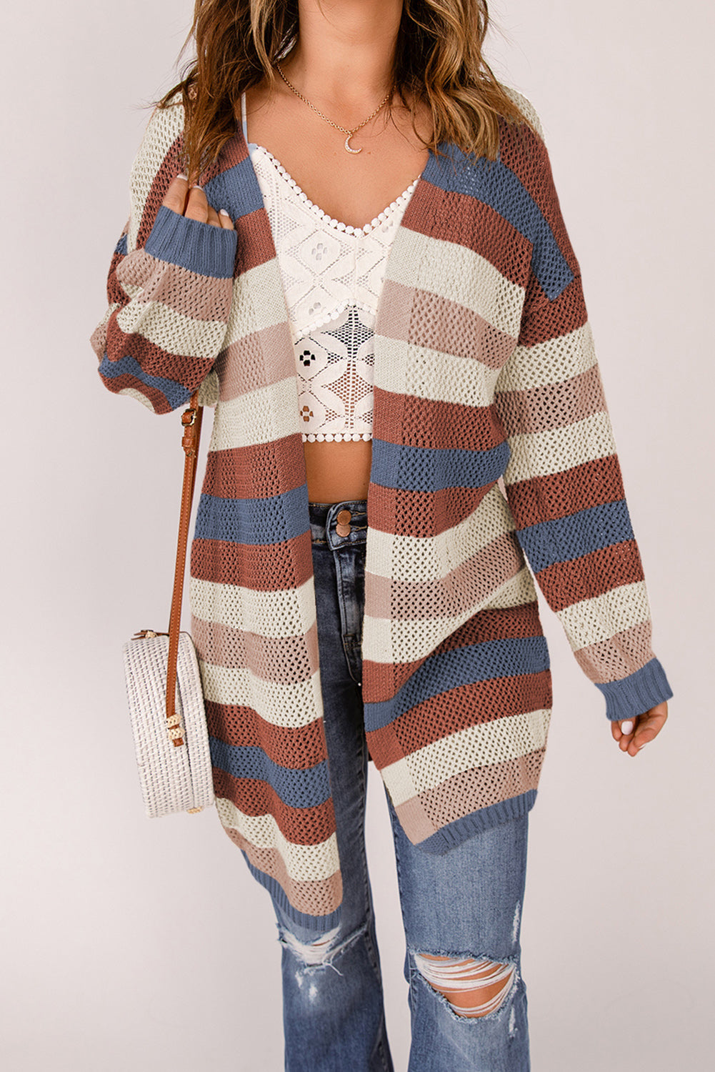 A stylish blue striped knit cardigan with a color block design, perfect for fall layering.