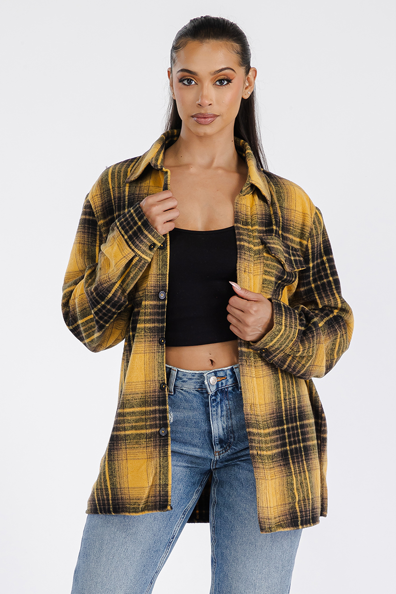 A stylish oversized flannel shacket for women, featuring a button closure and chest pockets, made from soft brushed fabric.