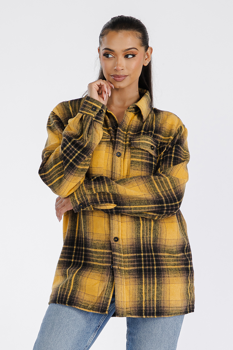 A stylish oversized flannel shacket for women, featuring a button closure and chest pockets, made from soft brushed fabric.