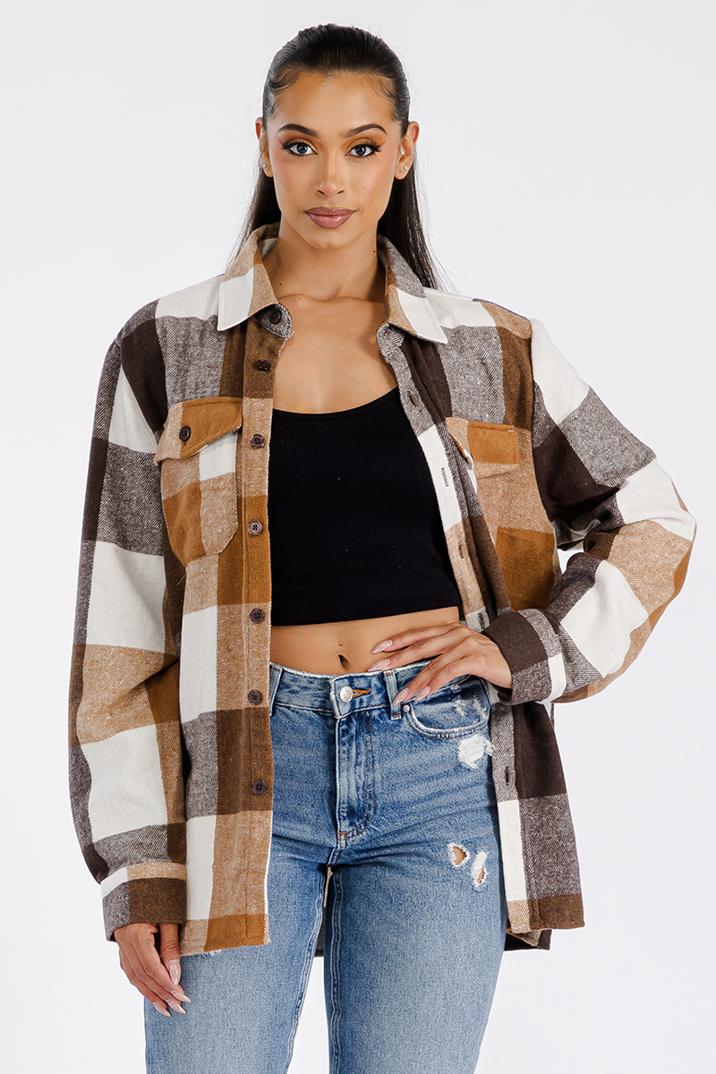 A stylish oversized flannel shacket for women, featuring a button closure and chest pockets, made from soft brushed fabric.