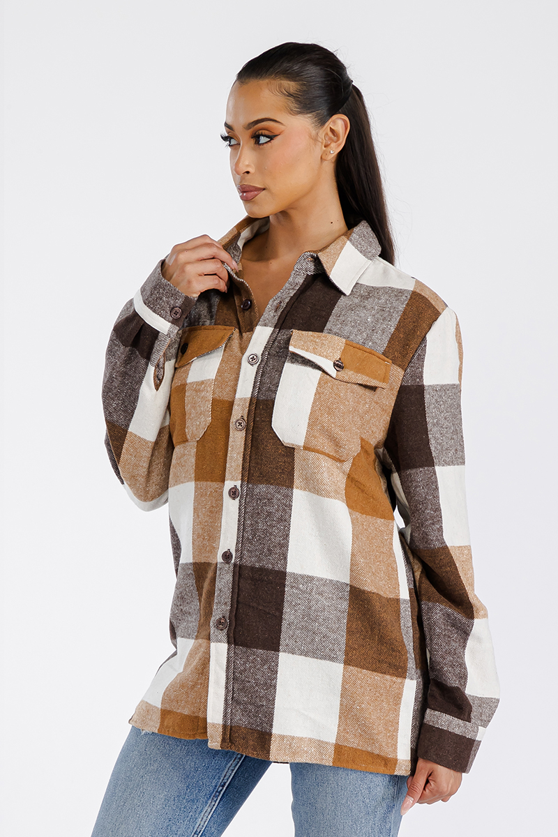 A stylish oversized flannel shacket for women, featuring a button closure and chest pockets, made from soft brushed fabric.