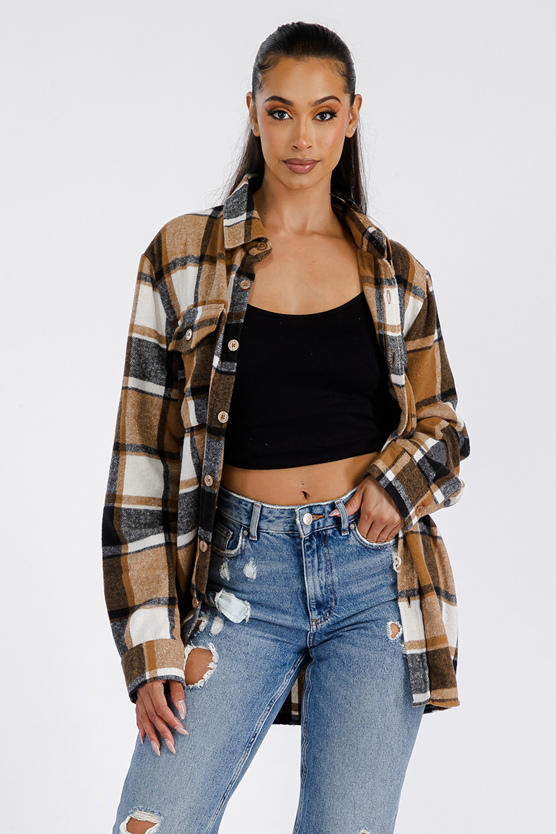 A stylish oversized flannel shacket for women, featuring a button closure and chest pockets, made from soft brushed fabric.