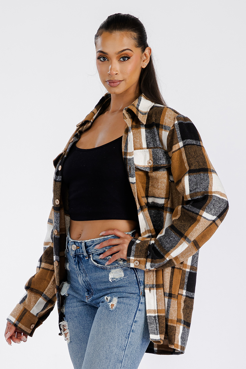 A stylish oversized flannel shacket for women, featuring a button closure and chest pockets, made from soft brushed fabric.