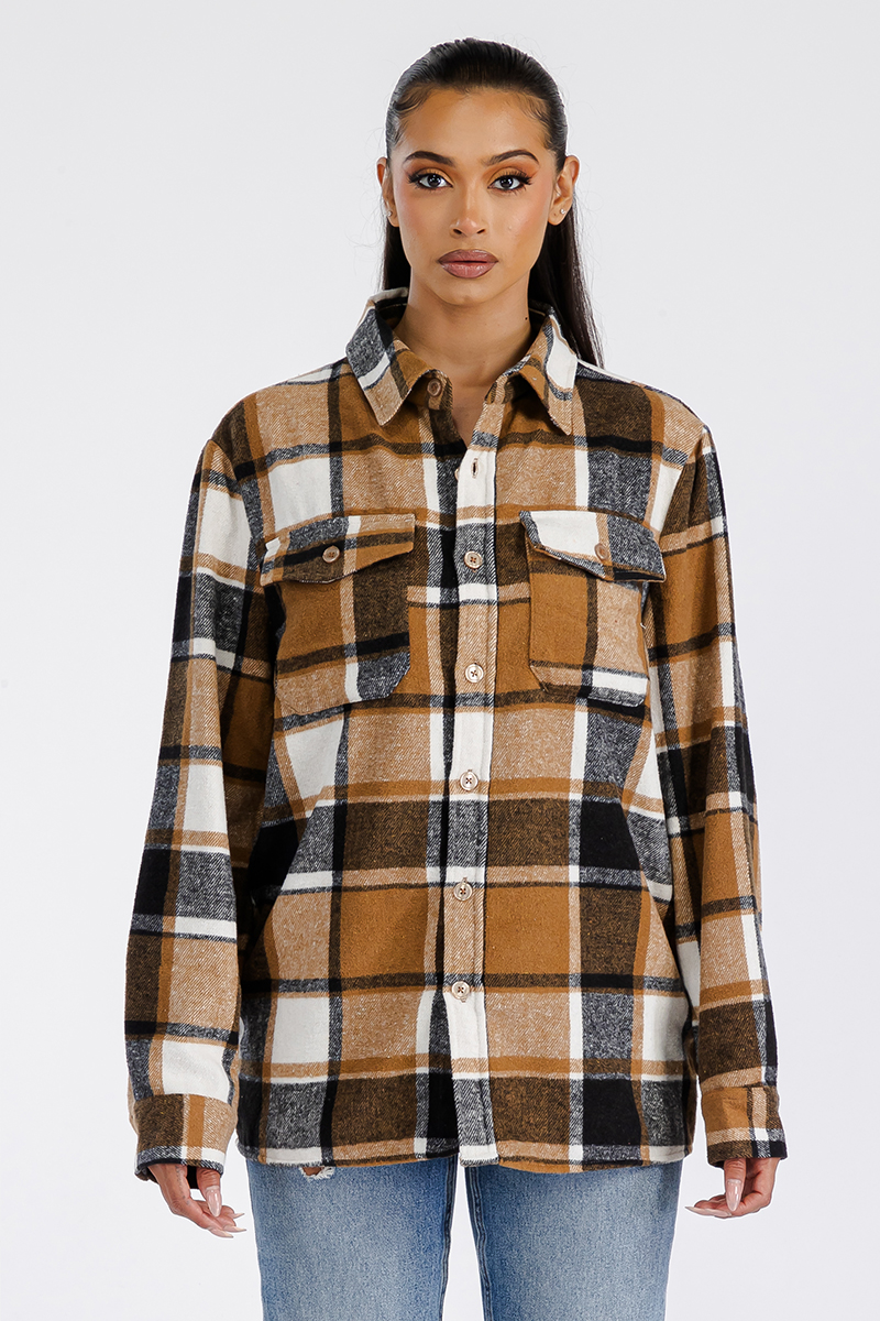 A stylish oversized flannel shacket for women, featuring a button closure and chest pockets, made from soft brushed fabric.