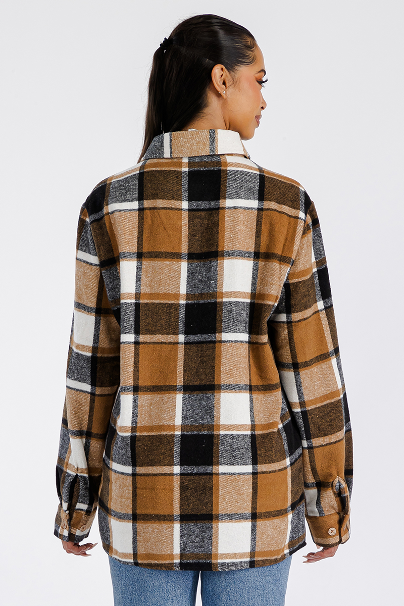 A stylish oversized flannel shacket for women, featuring a button closure and chest pockets, made from soft brushed fabric.