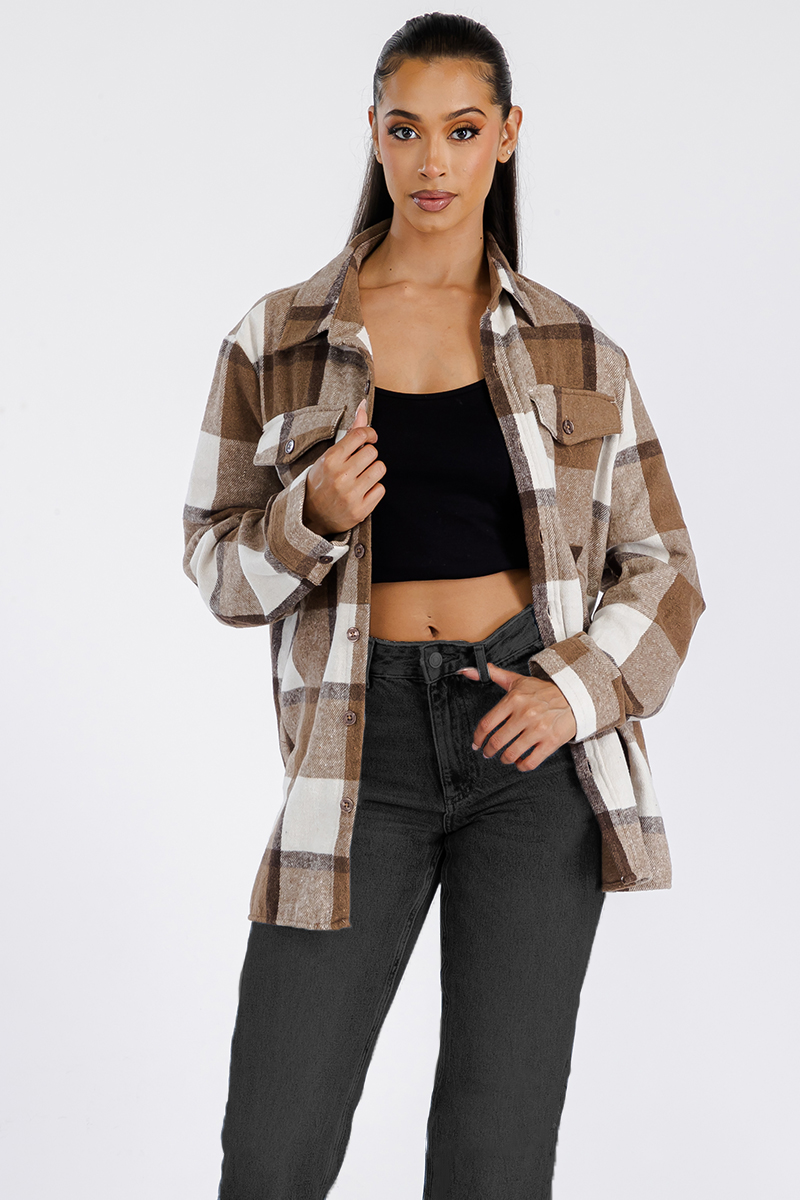 A stylish oversized flannel shacket for women, featuring a button closure and chest pockets, made from soft brushed fabric.