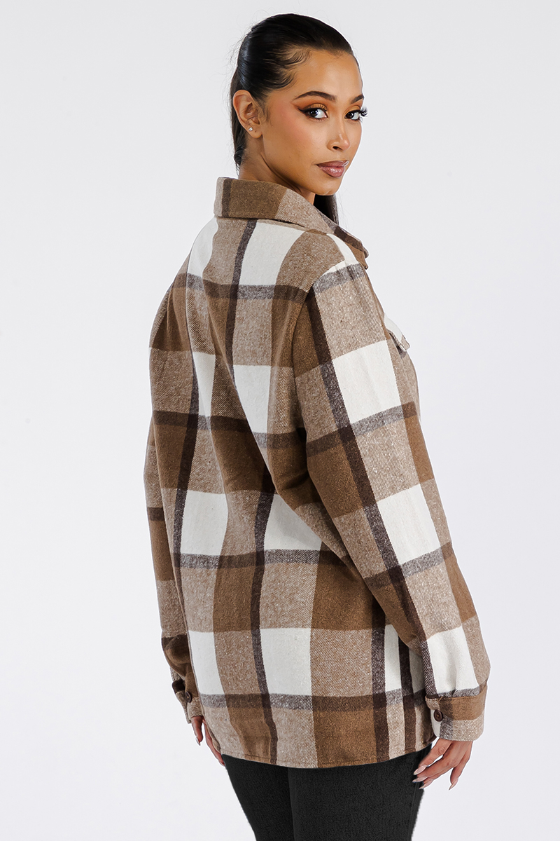 A stylish oversized flannel shacket for women, featuring a button closure and chest pockets, made from soft brushed fabric.