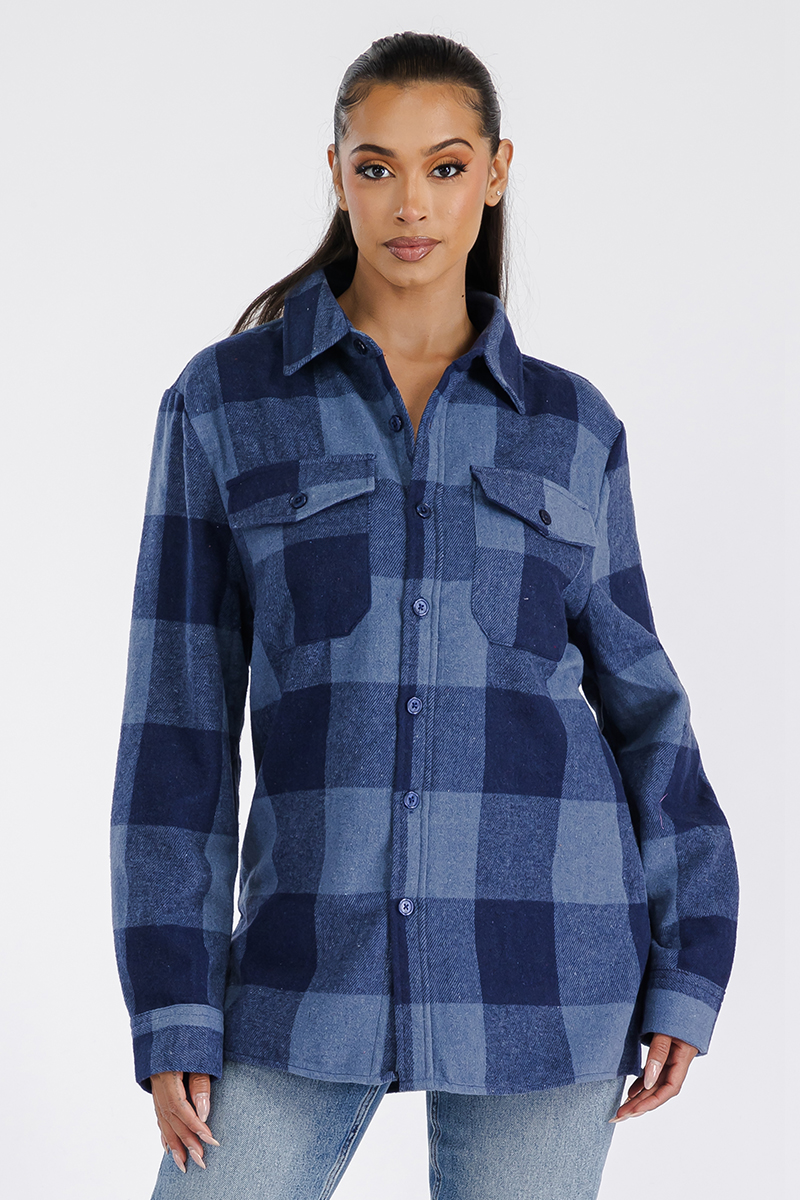 A stylish woman wearing a Boyfriend Oversized Soft Flannel Shacket, showcasing its soft fabric, button closure, and chest pockets.