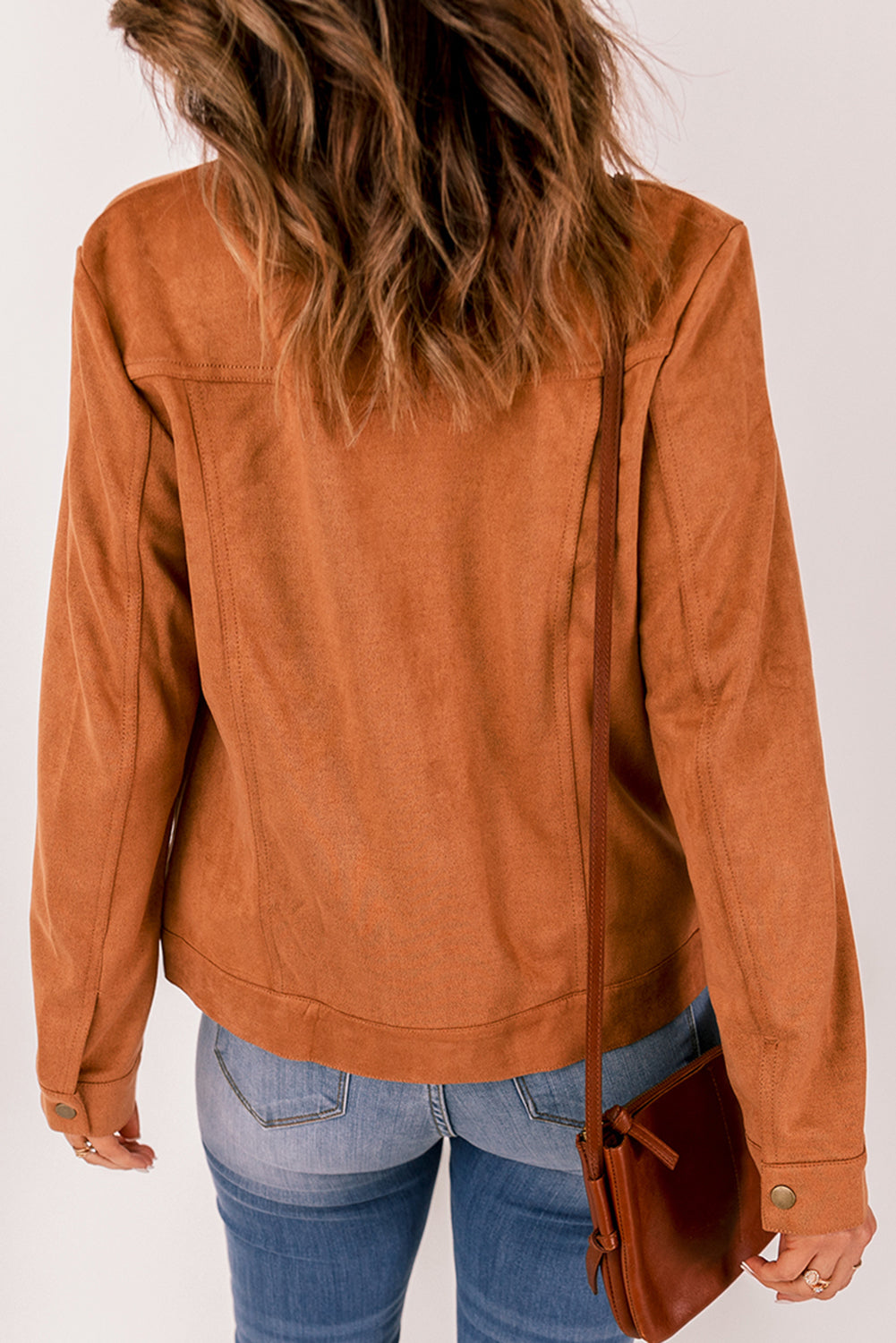 Brown suede jacket with flap pockets and snap button closure, perfect for winter wear.