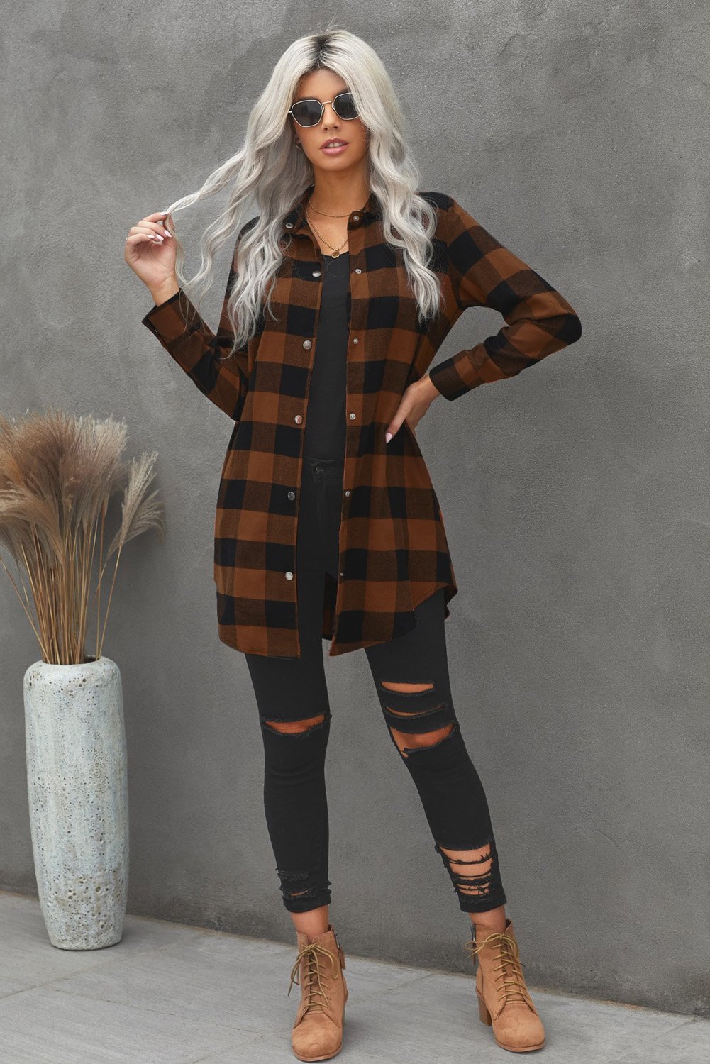 Brown plaid shacket with long sleeves and turn-down collar, perfect for winter layering.