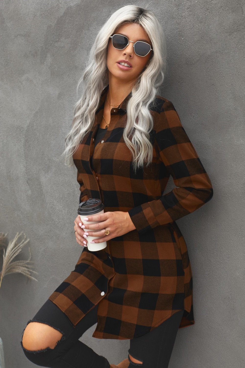 Brown plaid shacket with long sleeves and turn-down collar, perfect for winter layering.