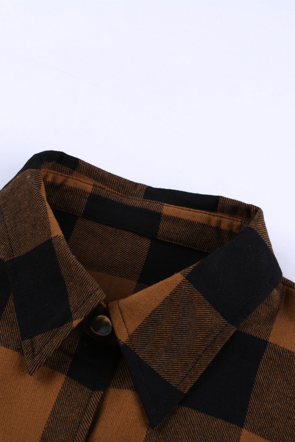 Brown plaid shacket with long sleeves and turn-down collar, perfect for winter layering.