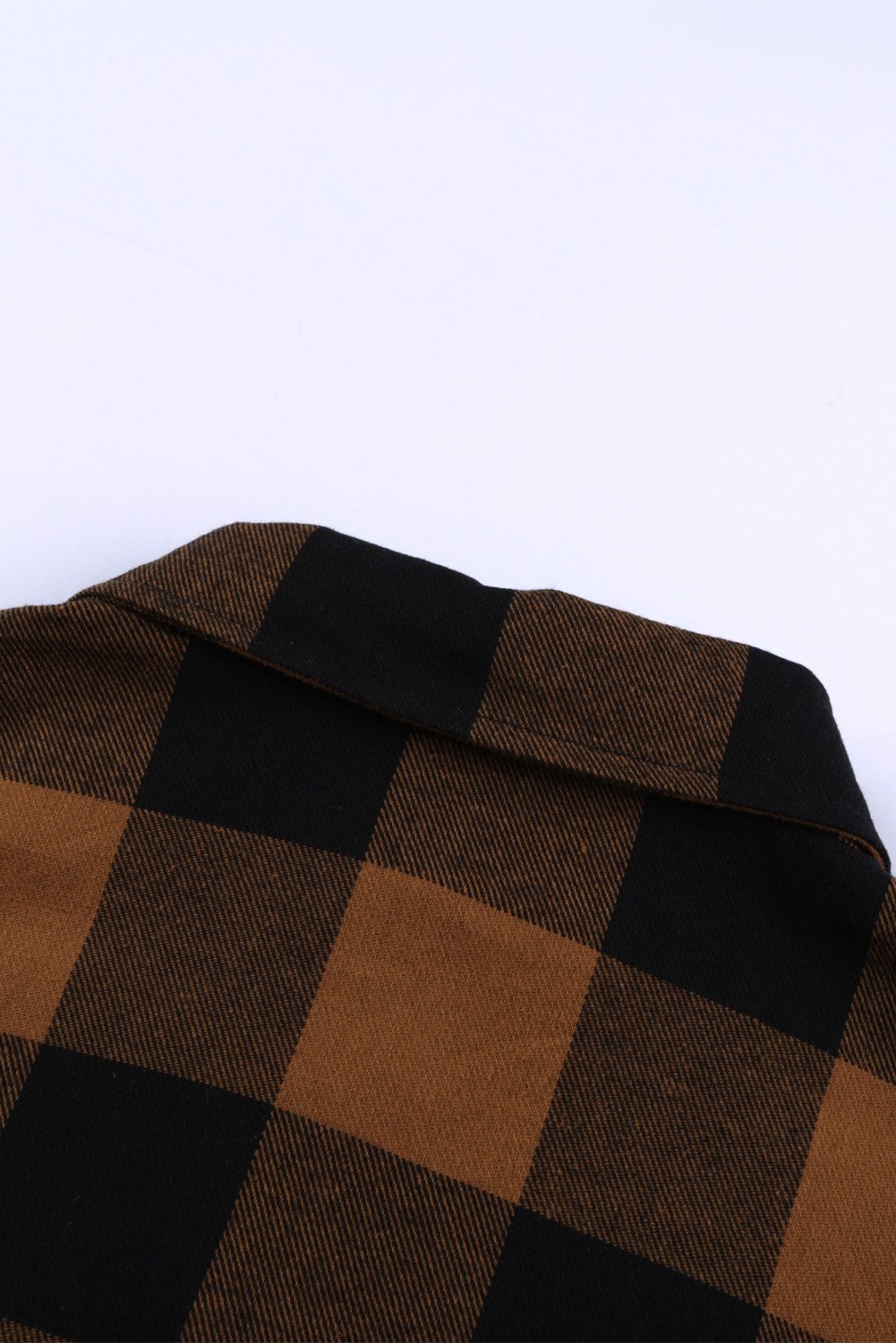 Brown plaid shacket with long sleeves and turn-down collar, perfect for winter layering.