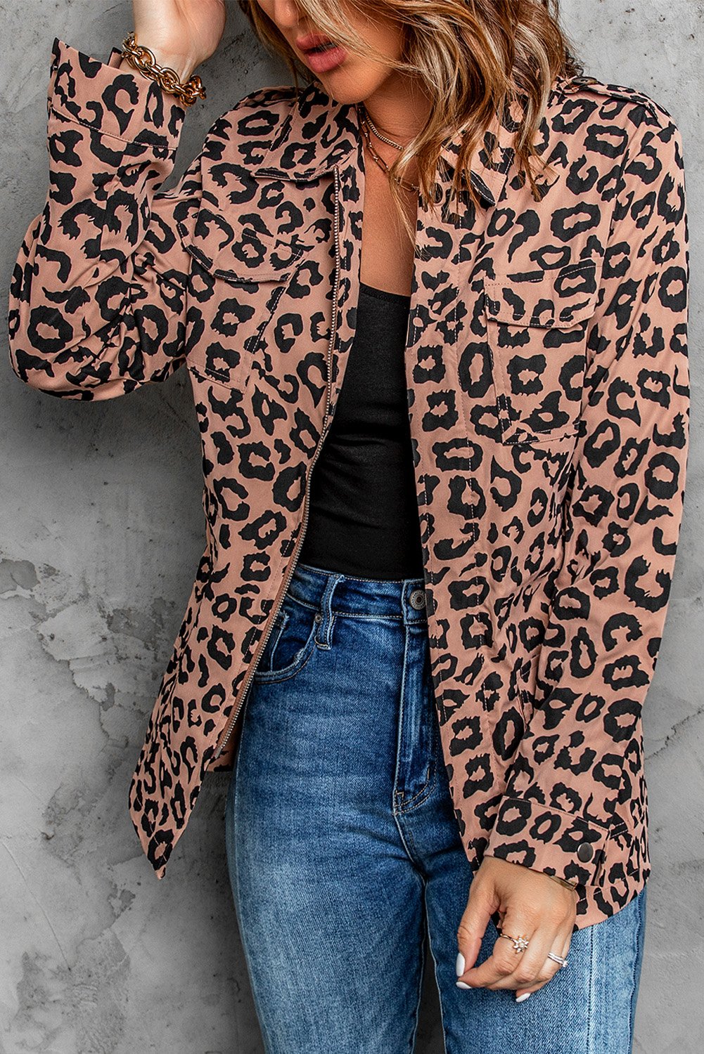 Brown leopard print coat with zipper closure and drawstring waist, featuring long sleeves and a lapel collar.