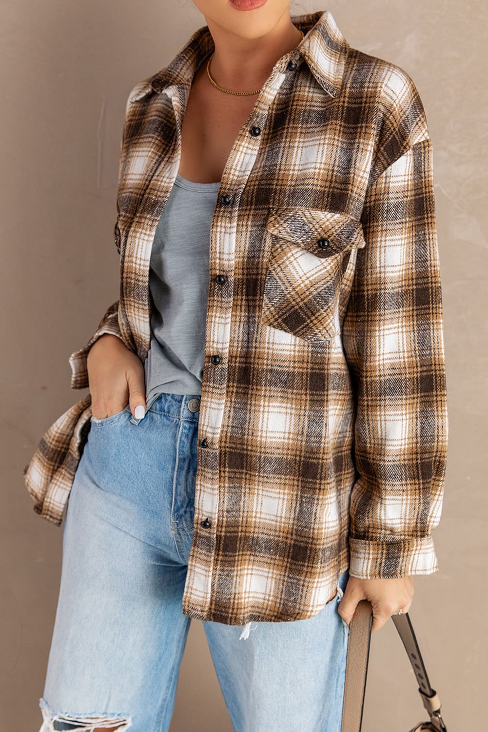 Buttons Pocketed Plaid Shacket featuring a turn-down collar, long sleeves, and front pockets in a classic plaid pattern.