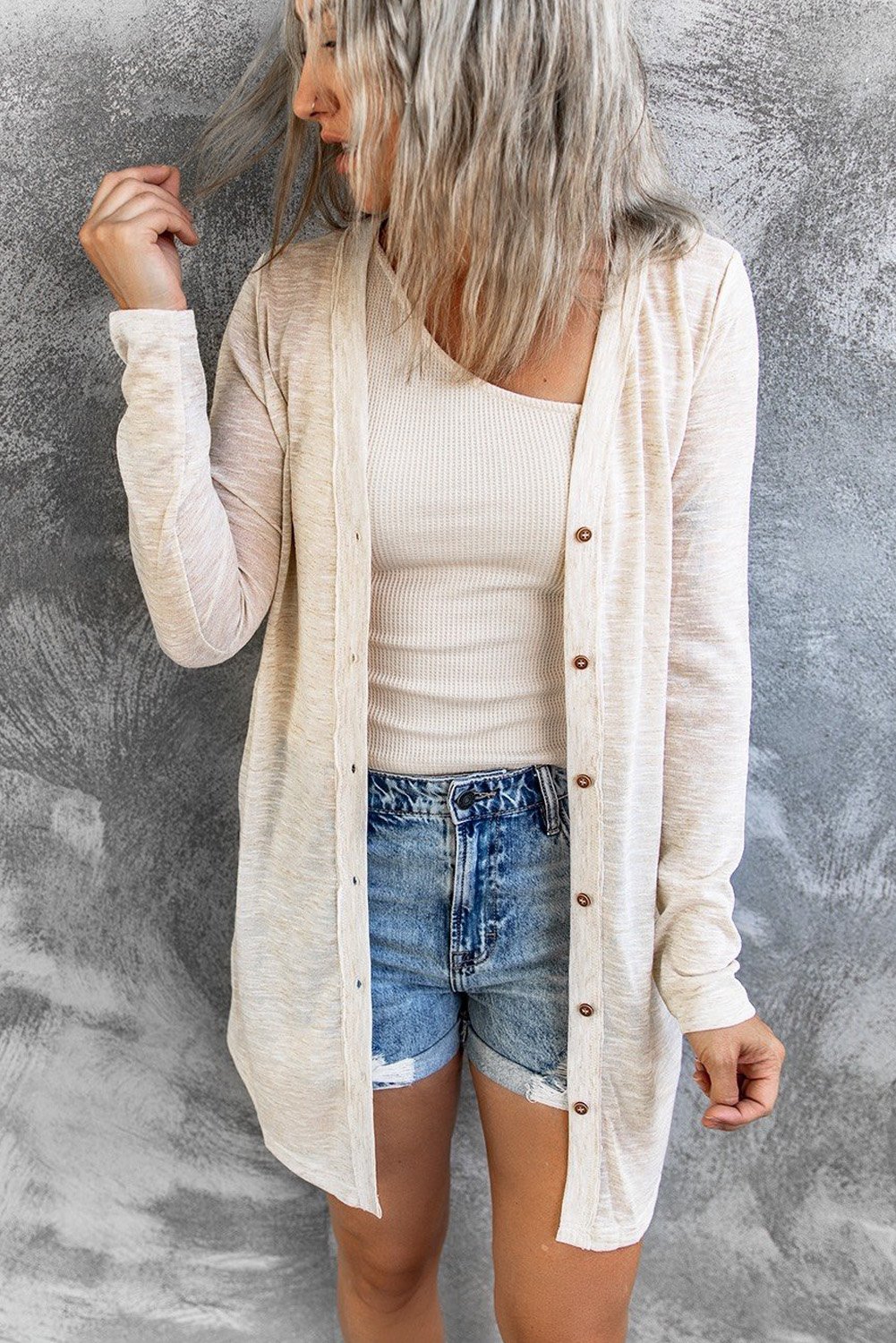 A stylish Comfy Beige Cardigan featuring an open front design and button closure, perfect for layering in fall and spring.