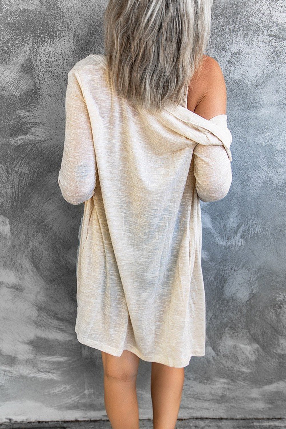 A stylish Comfy Beige Cardigan featuring an open front design and button closure, perfect for layering in fall and spring.